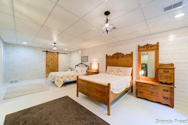 7561 Wiczer Dr, Whitehall, MI 49461 - bedroom with a paneled ceiling, a barn door, wood walls, and recessed lighting