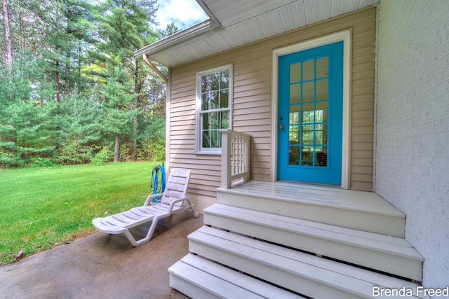 7561 Wiczer Dr, Whitehall, MI 49461 - doorway to property featuring a lawn