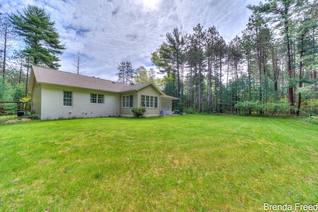 7561 Wiczer Dr, Whitehall, MI 49461 - view of grassy yard with central air condition unit