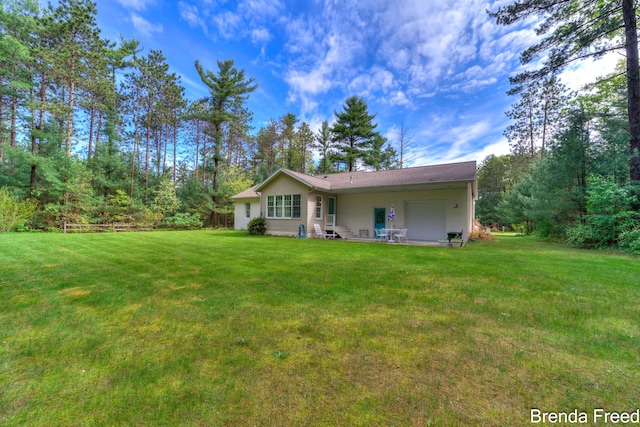 7561 Wiczer Dr, Whitehall, MI 49461 - rear view of house with a lawn