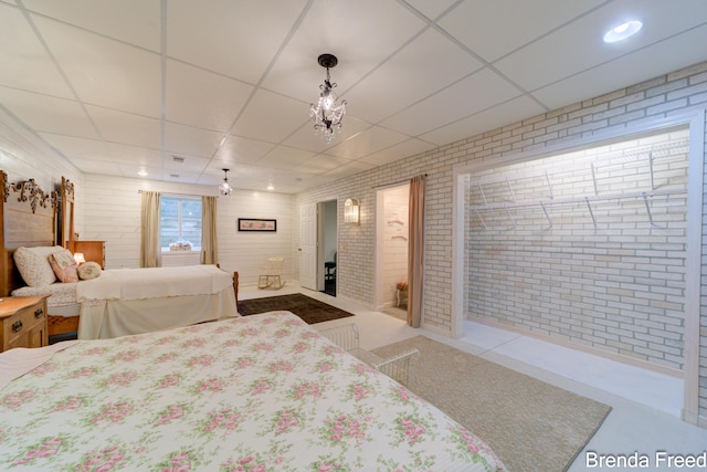 7561 Wiczer Dr, Whitehall, MI 49461 - bedroom with brick wall and a drop ceiling