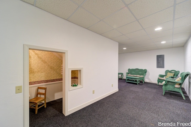 7561 Wiczer Dr, Whitehall, MI 49461 - living area with electric panel, carpet flooring, a drop ceiling, recessed lighting, and baseboards