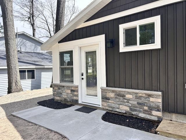 855 W Locust St, White Cloud, MI 49349 - entrance to property with board and batten siding and stone siding