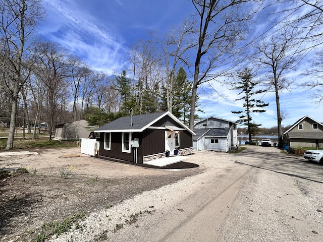 855 W Locust St, White Cloud, MI 49349 - view of front of house with dirt driveway