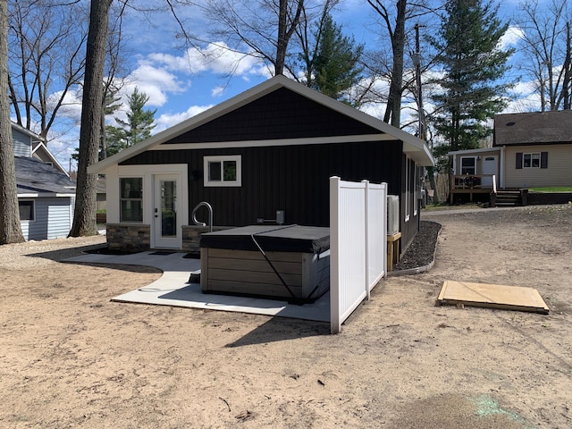 855 W Locust St, White Cloud, MI 49349 - back of property featuring a wooden deck and stone siding