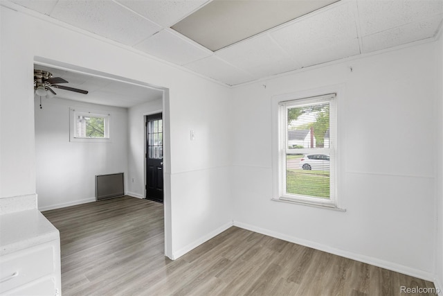 20515 Hollywood St, Harper Woods, MI 48225 - unfurnished room featuring a drop ceiling, light wood-style flooring, baseboards, and ceiling fan