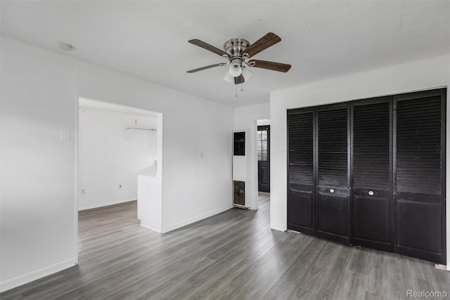 20515 Hollywood St, Harper Woods, MI 48225 - unfurnished bedroom featuring wood finished floors, baseboards, and ceiling fan