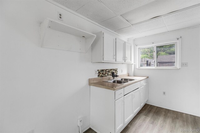 20515 Hollywood St, Harper Woods, MI 48225 - bar featuring a sink, wood finished floors, and a paneled ceiling