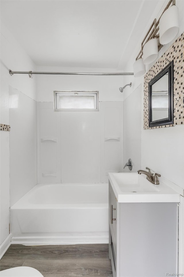 20515 Hollywood St, Harper Woods, MI 48225 - bathroom featuring vanity, shower / bath combination, wood finished floors, and toilet
