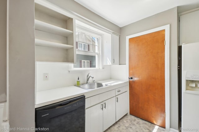 6008 Andersonville Rd, Waterford, MI 48329 - kitchen featuring white fridge with ice dispenser, black dishwasher, a sink, white cabinetry, and light countertops