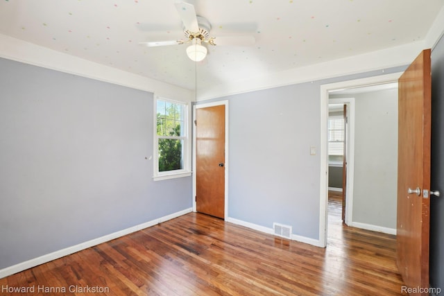 6008 Andersonville Rd, Waterford, MI 48329 - empty room featuring wood finished floors, baseboards, and ceiling fan