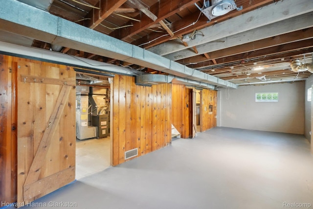 6008 Andersonville Rd, Waterford, MI 48329 - basement with wood walls and heating unit