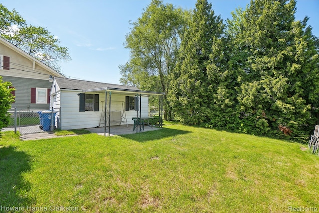 6008 Andersonville Rd, Waterford, MI 48329 - view of yard featuring a patio area
