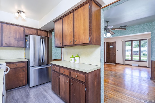 2500 Howe St, Shelby, MI 48317 - kitchen featuring freestanding refrigerator, light countertops, light wood finished floors, and a ceiling fan