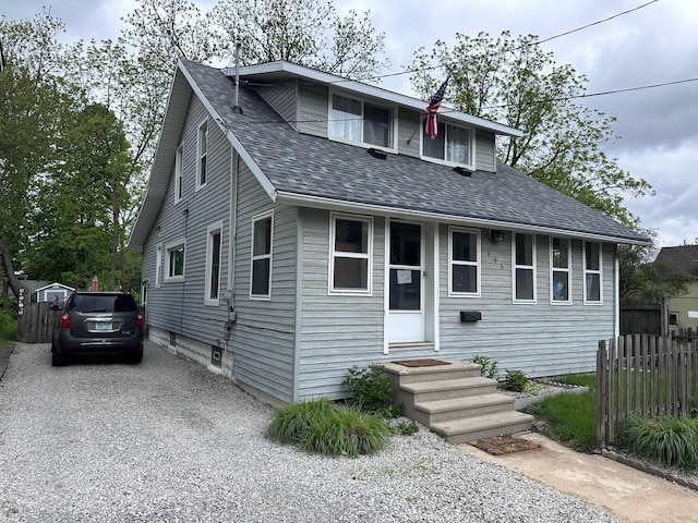 406 S Elm Ave, Jackson, MI 49203 - bungalow-style home with roof with shingles, entry steps, and driveway
