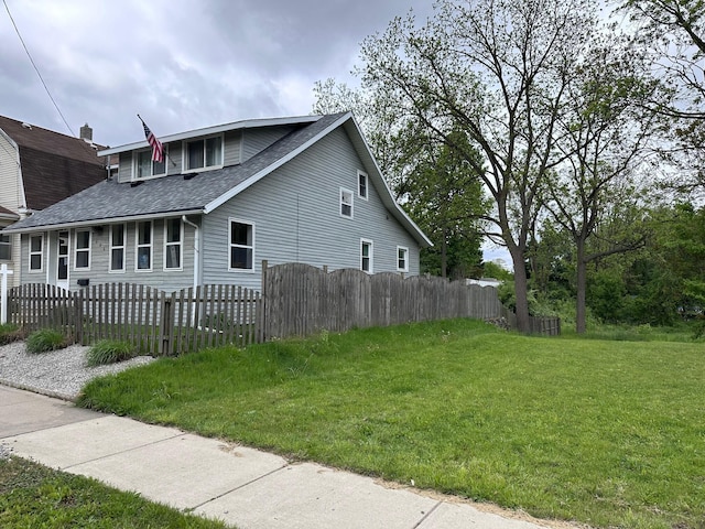 406 S Elm Ave, Jackson, MI 49203 - view of side of property featuring a shingled roof