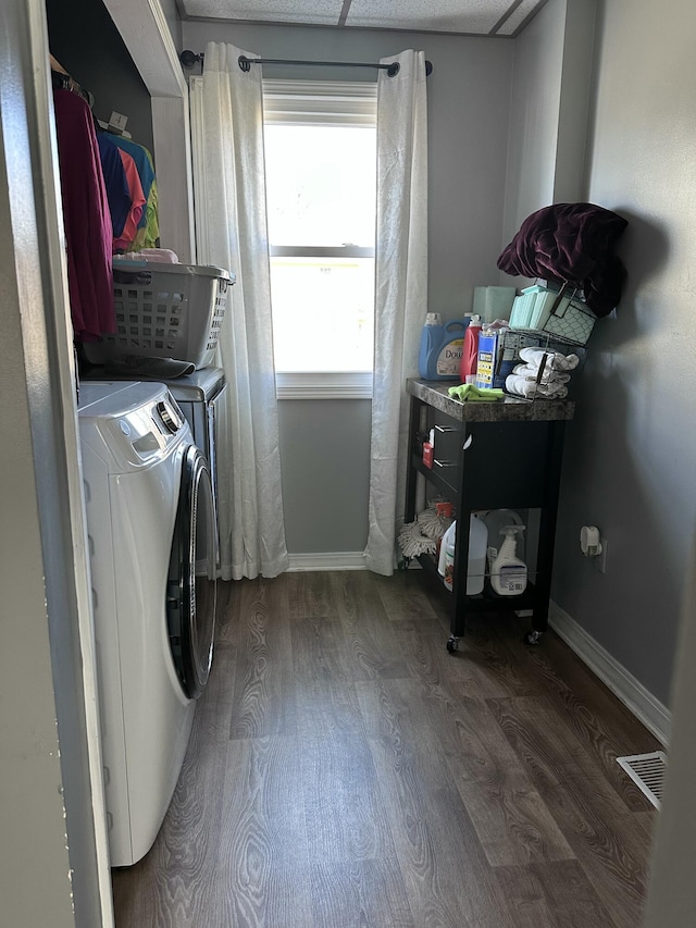 406 S Elm Ave, Jackson, MI 49203 - washroom featuring washing machine and clothes dryer, wood finished floors, and baseboards