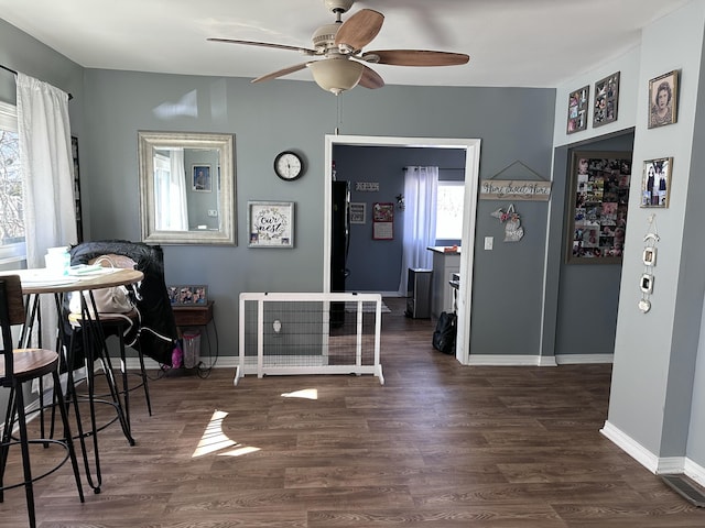 406 S Elm Ave, Jackson, MI 49203 - dining area with ceiling fan, wood finished floors, and baseboards