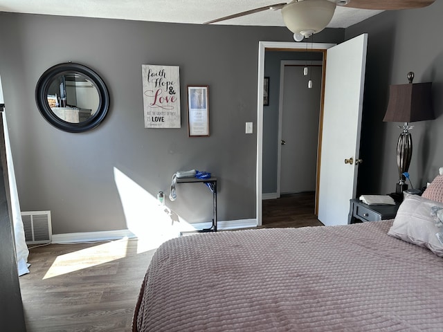406 S Elm Ave, Jackson, MI 49203 - bedroom featuring wood finished floors, baseboards, and a ceiling fan