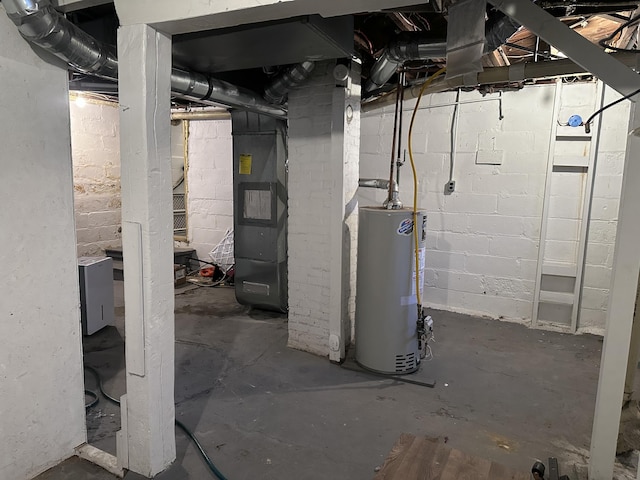 406 S Elm Ave, Jackson, MI 49203 - unfinished below grade area featuring water heater and heating unit