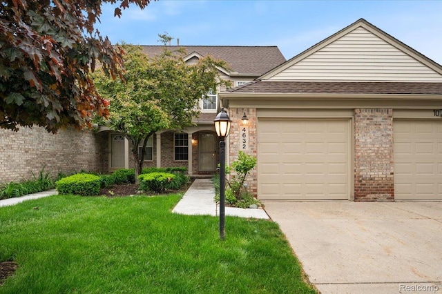 4632 Hunters Cir W, Canton, MI 48188 - view of front of house with concrete driveway, a garage, brick siding, a front lawn, and a shingled roof