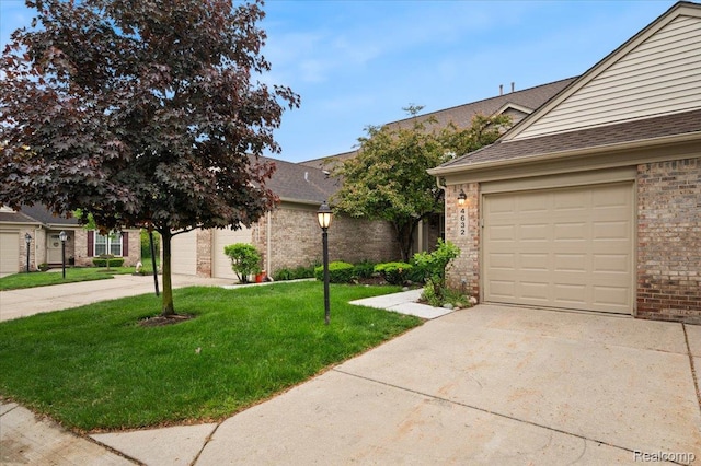 4632 Hunters Cir W, Canton, MI 48188 - view of front facade with brick siding, driveway, a front lawn, and roof with shingles