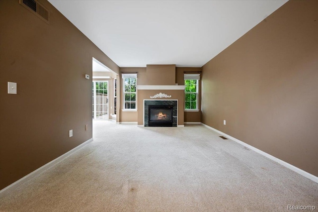 4632 Hunters Cir W, Canton, MI 48188 - unfurnished living room featuring a high end fireplace, baseboards, and carpet flooring