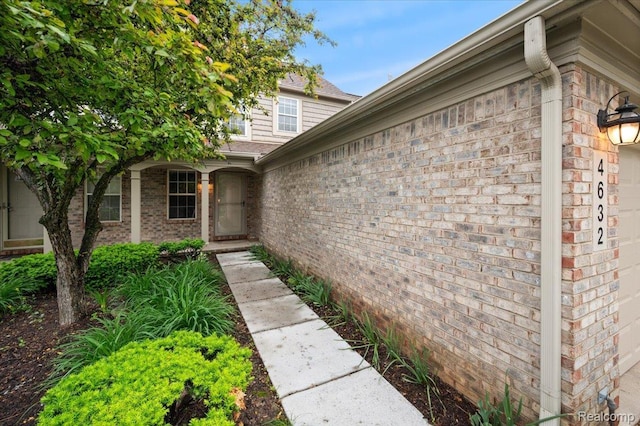 4632 Hunters Cir W, Canton, MI 48188 - view of exterior entry featuring brick siding and a garage