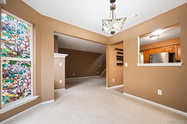 4632 Hunters Cir W, Canton, MI 48188 - spare room with light colored carpet, stairway, and baseboards