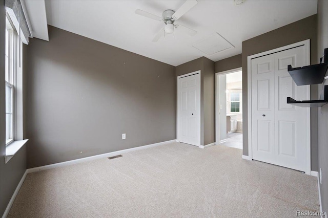 4632 Hunters Cir W, Canton, MI 48188 - unfurnished bedroom with two closets, carpet, baseboards, and attic access
