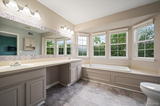 4632 Hunters Cir W, Canton, MI 48188 - bathroom with double vanity, a garden tub, toilet, and stone finish flooring