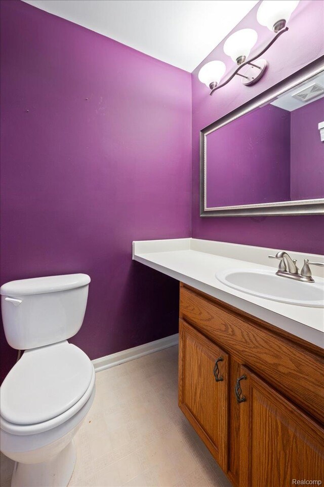 4632 Hunters Cir W, Canton, MI 48188 - half bathroom featuring vanity, toilet, and baseboards