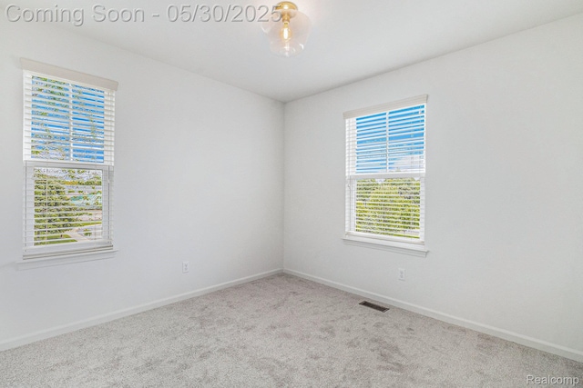 478 N Wixom Rd, Wixom, MI 48393 - carpeted empty room with baseboards
