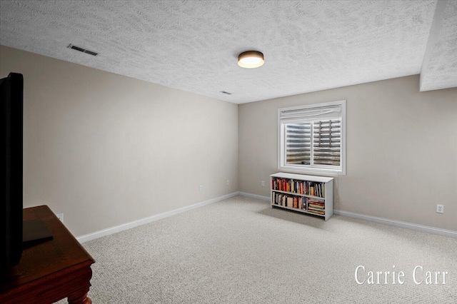 745 Abbey Mill Ct SE, Ada, MI 49301 - empty room with baseboards, carpet floors, and a textured ceiling
