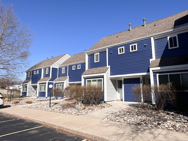 261 Black River St Unit F, South Haven, MI 49090 - view of front facade with uncovered parking