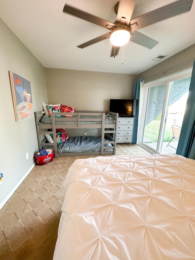 261 Black River St Unit F, South Haven, MI 49090 - bedroom featuring access to outside, carpet flooring, a ceiling fan, and baseboards