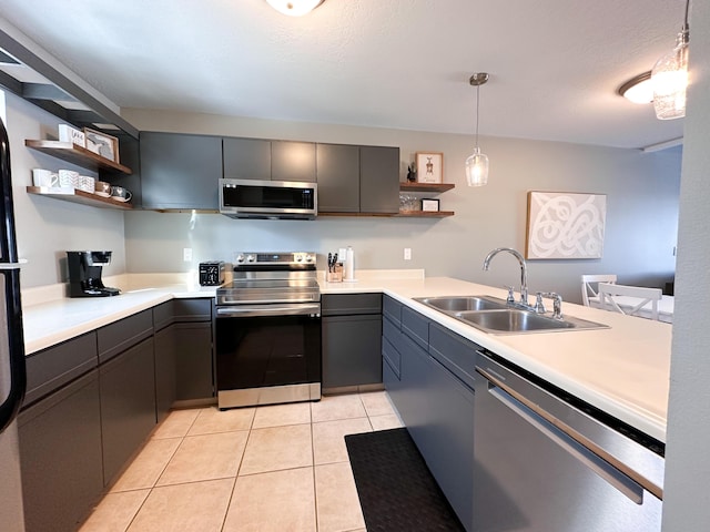 261 Black River St Unit F, South Haven, MI 49090 - kitchen with appliances with stainless steel finishes, open shelves, a sink, and light countertops