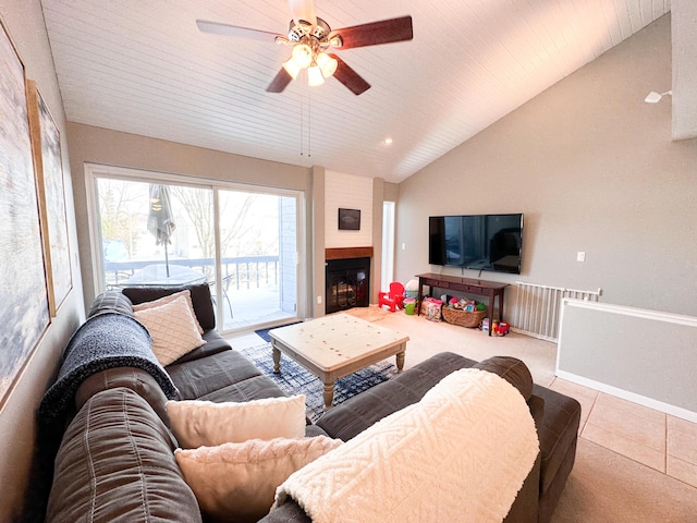 261 Black River St Unit F, South Haven, MI 49090 - tiled living room with ceiling fan, lofted ceiling, a fireplace, and baseboards
