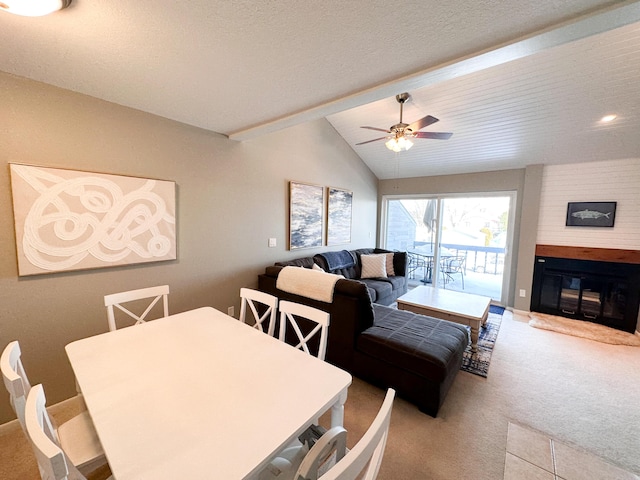 261 Black River St Unit F, South Haven, MI 49090 - dining area with carpet flooring, a ceiling fan, and a fireplace