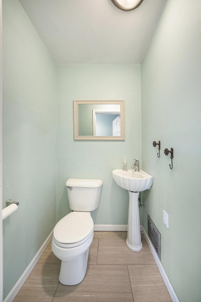 647 Church St, Grass Lake, MI 49240 - bathroom featuring toilet and baseboards