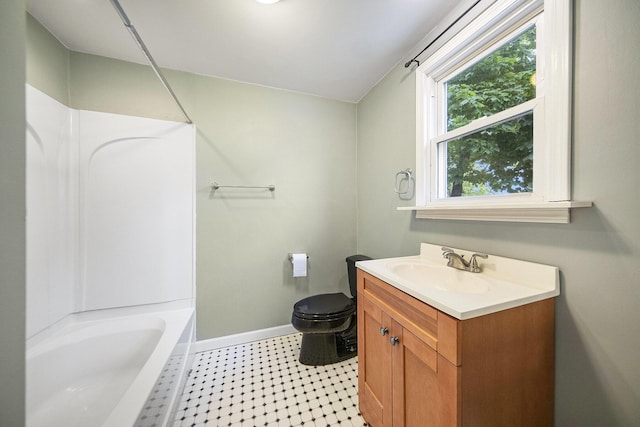 647 Church St, Grass Lake, MI 49240 - full bathroom featuring vanity, baseboards, toilet, and  shower combination
