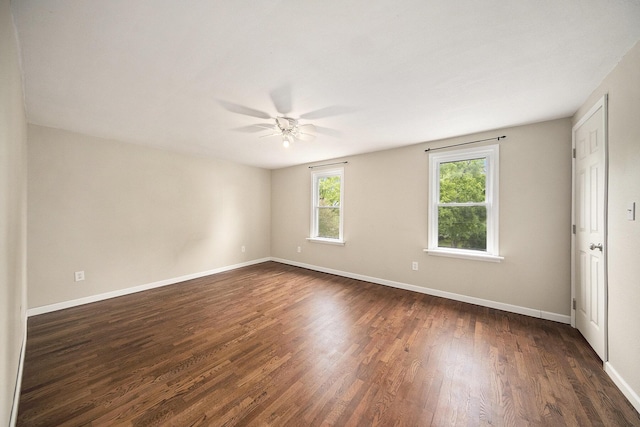 647 Church St, Grass Lake, MI 49240 - unfurnished room with ceiling fan, dark wood-type flooring, and baseboards