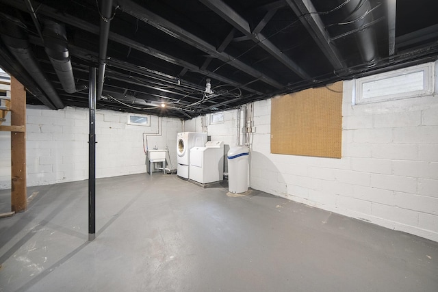 647 Church St, Grass Lake, MI 49240 - unfinished below grade area featuring washer and dryer, a sink, and a water softener system