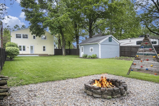 647 Church St, Grass Lake, MI 49240 - view of yard featuring an outdoor fire pit and an outdoor structure