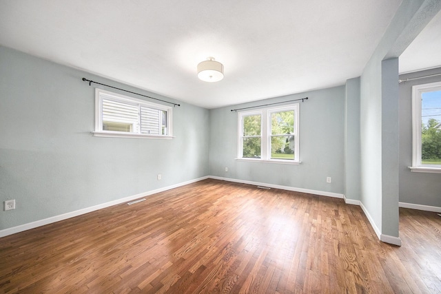647 Church St, Grass Lake, MI 49240 - spare room with wood finished floors and baseboards