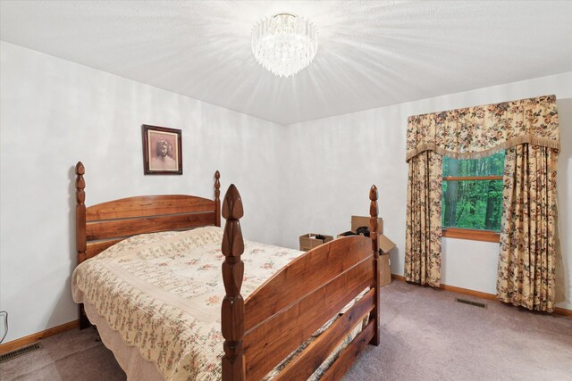 37965 County Road 388, Gobles, MI 49055 - carpeted bedroom featuring a chandelier and baseboards