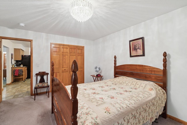 37965 County Road 388, Gobles, MI 49055 - bedroom featuring a chandelier, light carpet, a closet, and baseboards