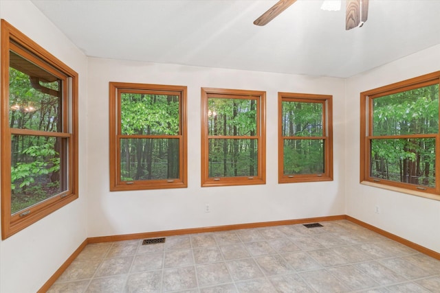 37965 County Road 388, Gobles, MI 49055 - spare room with baseboards, a ceiling fan, and light tile patterned floors