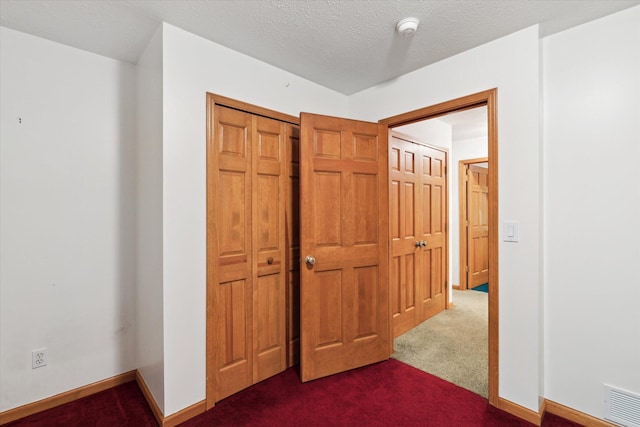 37965 County Road 388, Gobles, MI 49055 - unfurnished bedroom featuring dark carpet, a closet, and baseboards