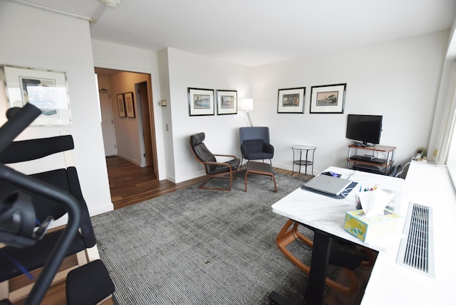 555 E William St Unit 21E, Ann Arbor, MI 48104 - home office featuring wood finished floors and baseboards